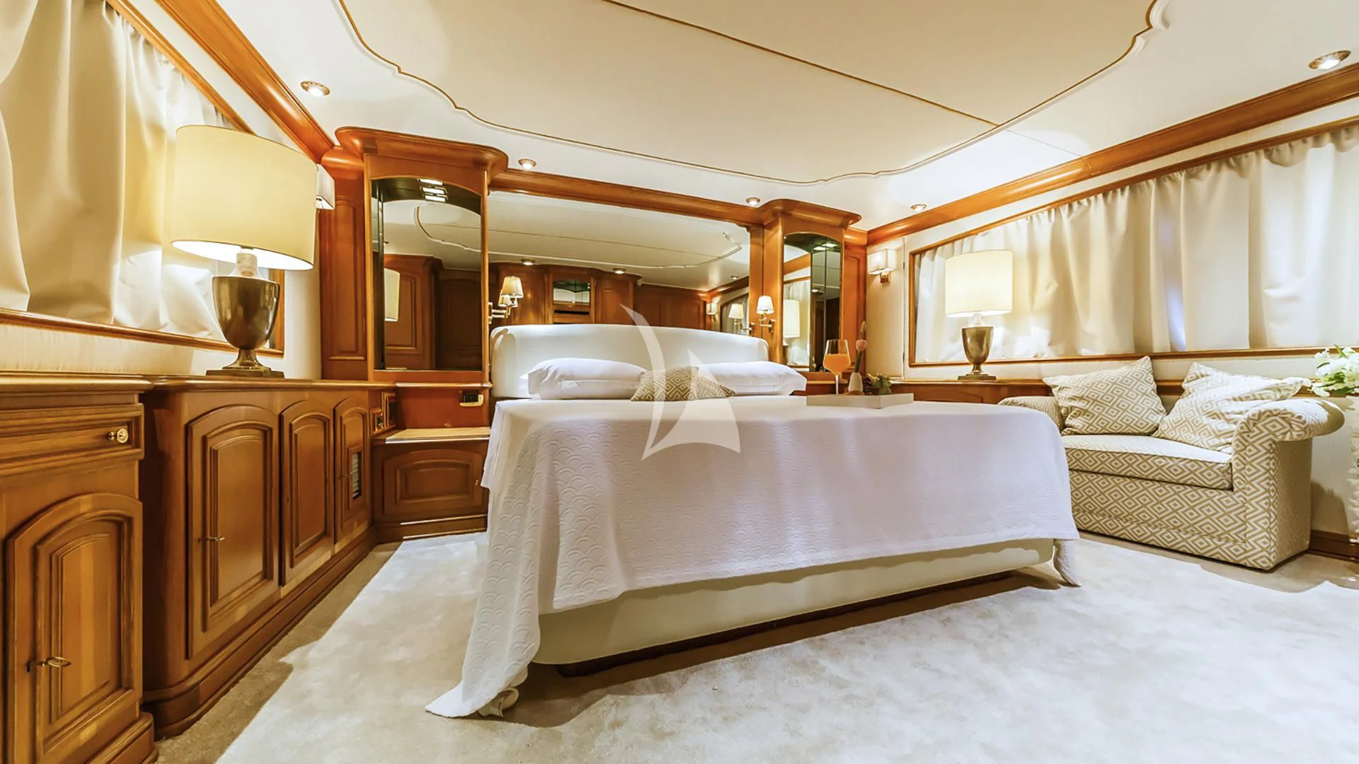 a bedroom with a bed and a couch aboard TO JE TO Yacht for Sale