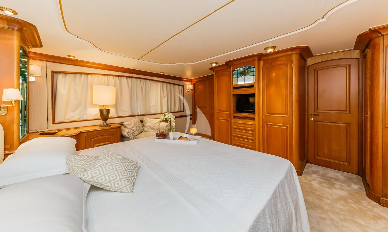 a bed with white sheets and pillows aboard TO JE TO Yacht for Sale