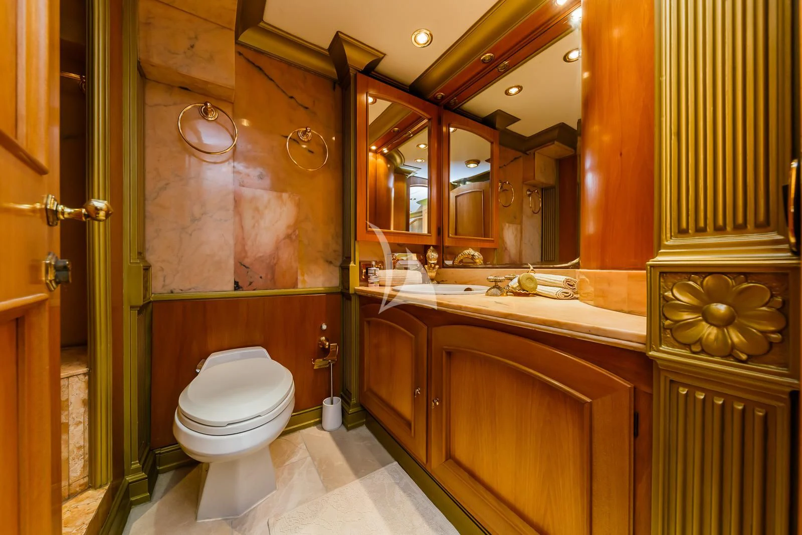 a bathroom with a toilet and a mirror aboard TO JE TO Yacht for Sale