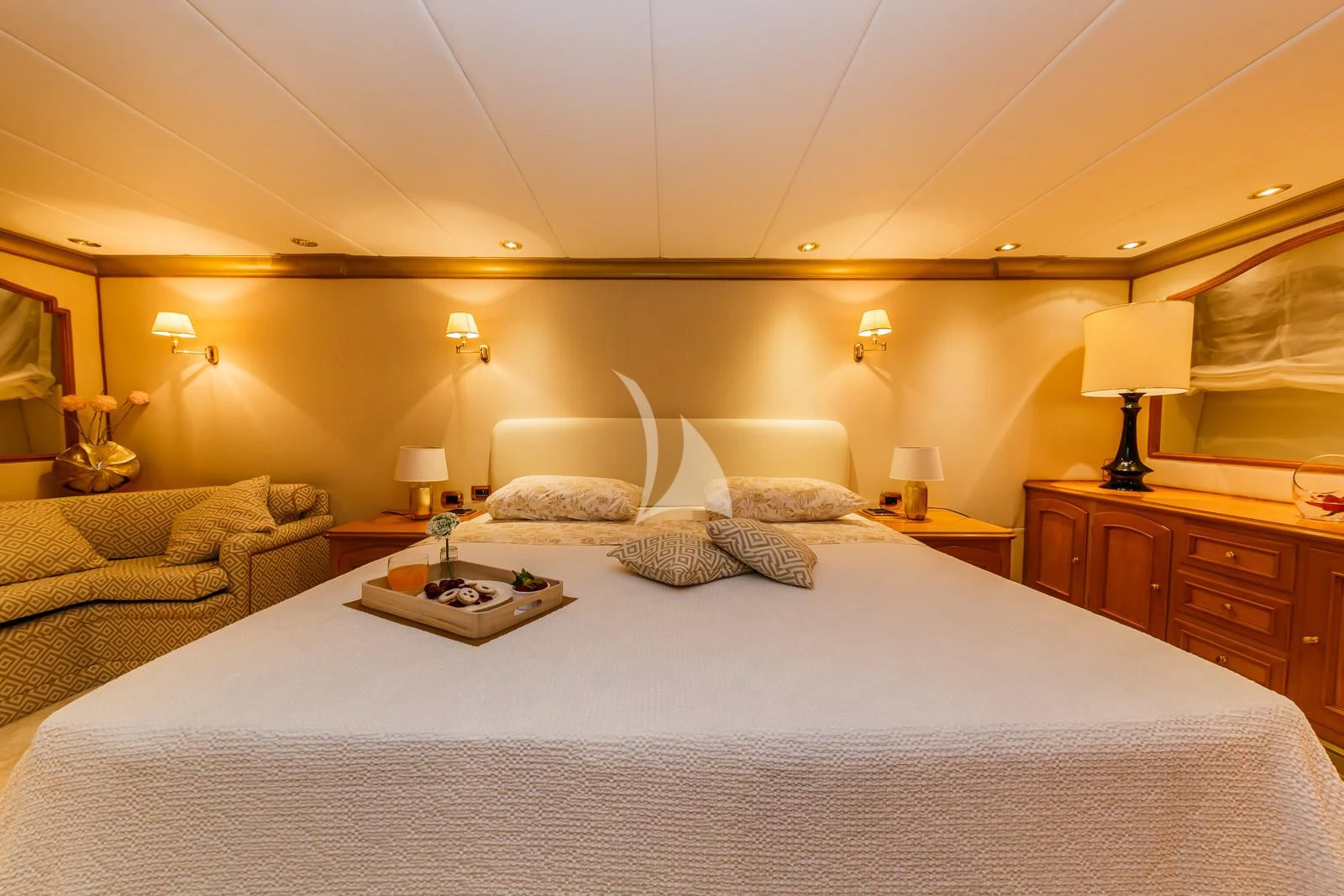 a bed with a white bed spread aboard TO JE TO Yacht for Sale