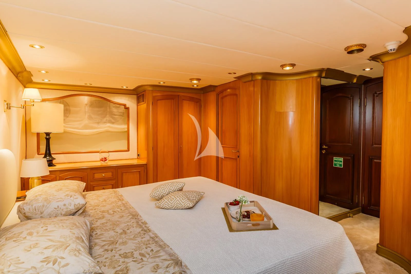 a hotel room with a bed and a tray of food aboard TO JE TO Yacht for Sale