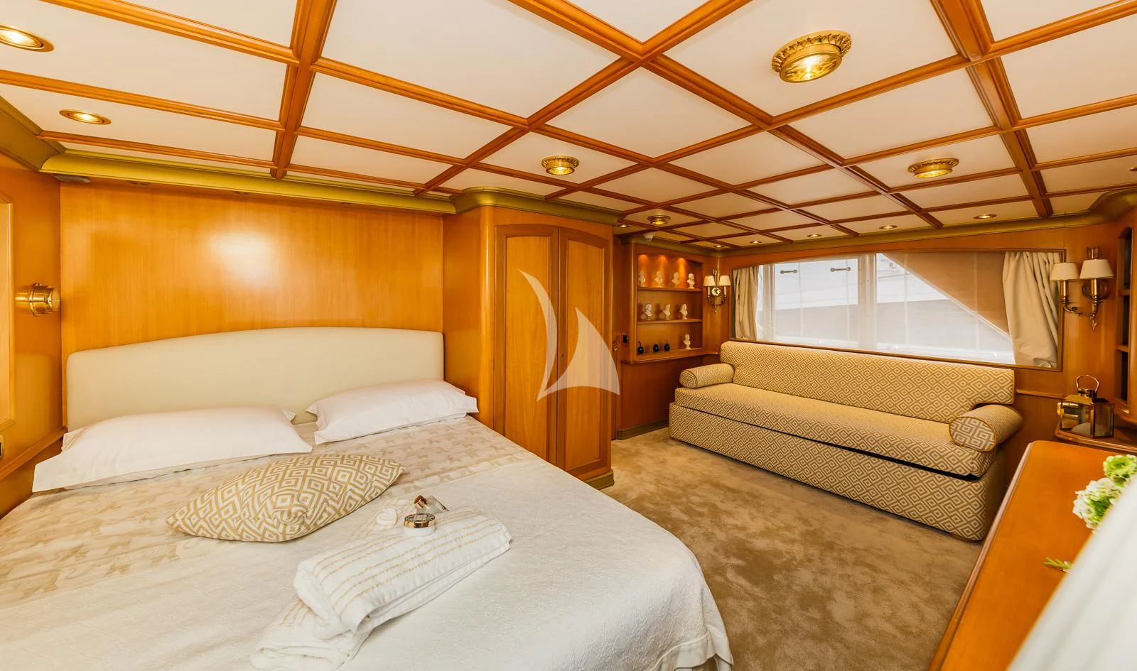 a room with a bed and a couch aboard TO JE TO Yacht for Sale