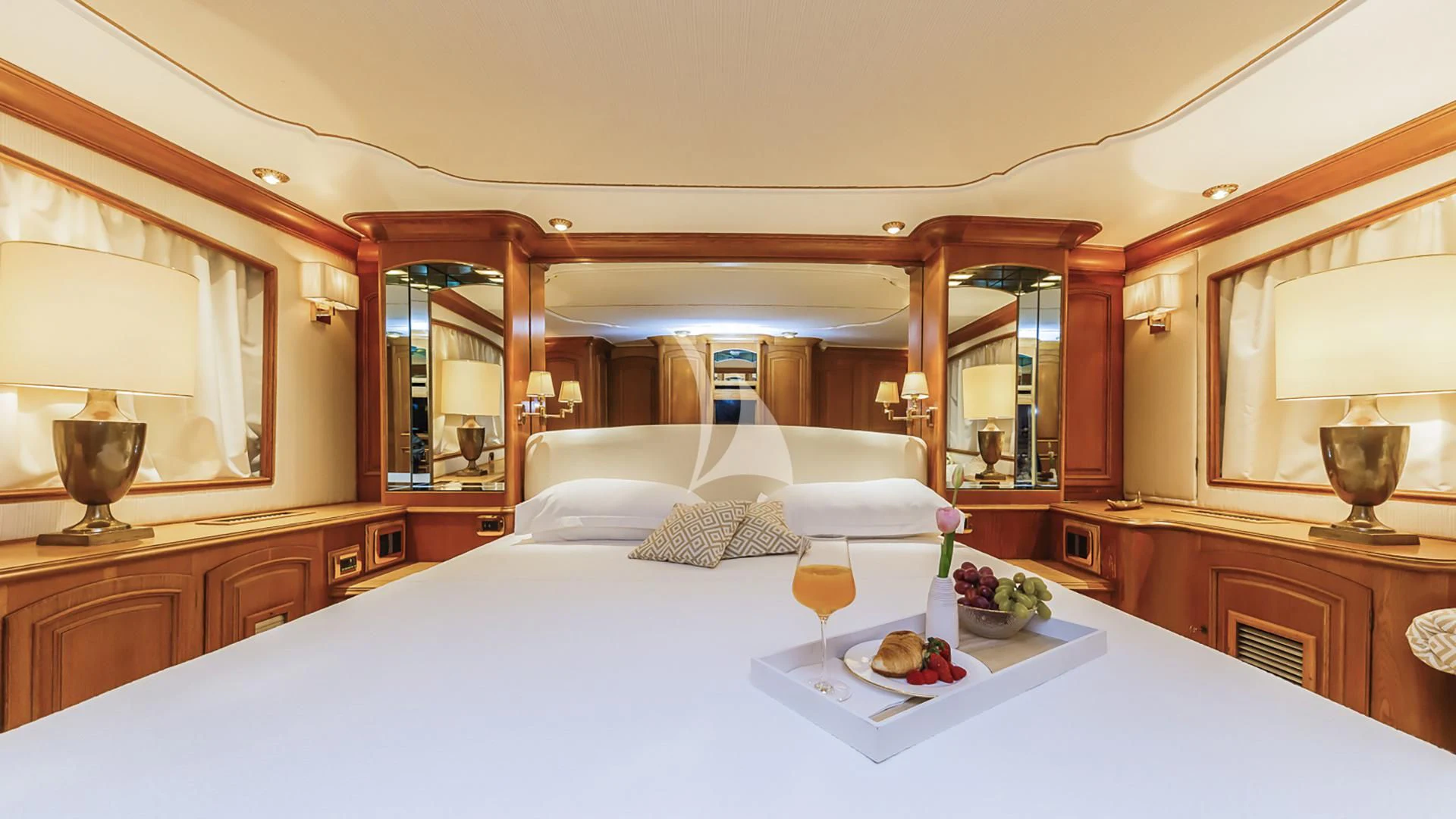 a hotel room with a bed and a glass of wine aboard TO JE TO Yacht for Sale