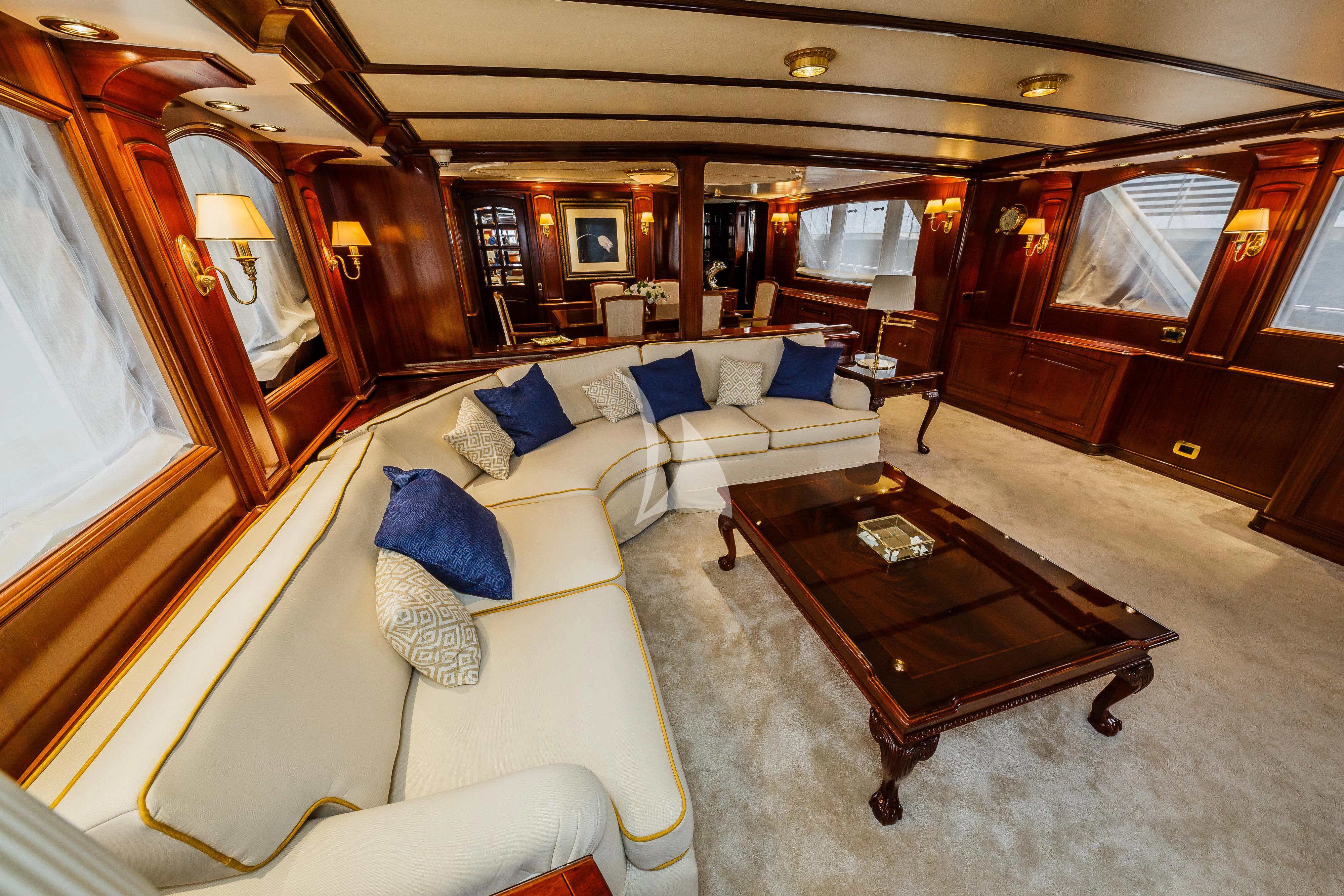 a room with a couch and a table aboard TO JE TO Yacht for Sale