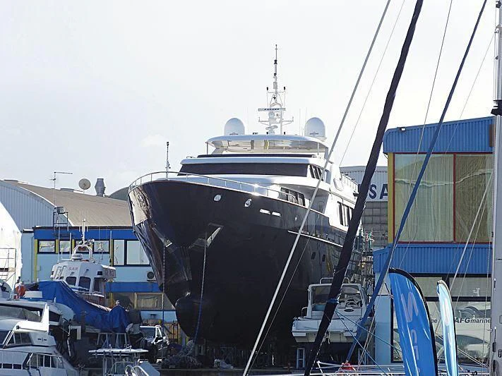 a large boat docked in a harbor aboard ANTARES STAR Yacht for Sale