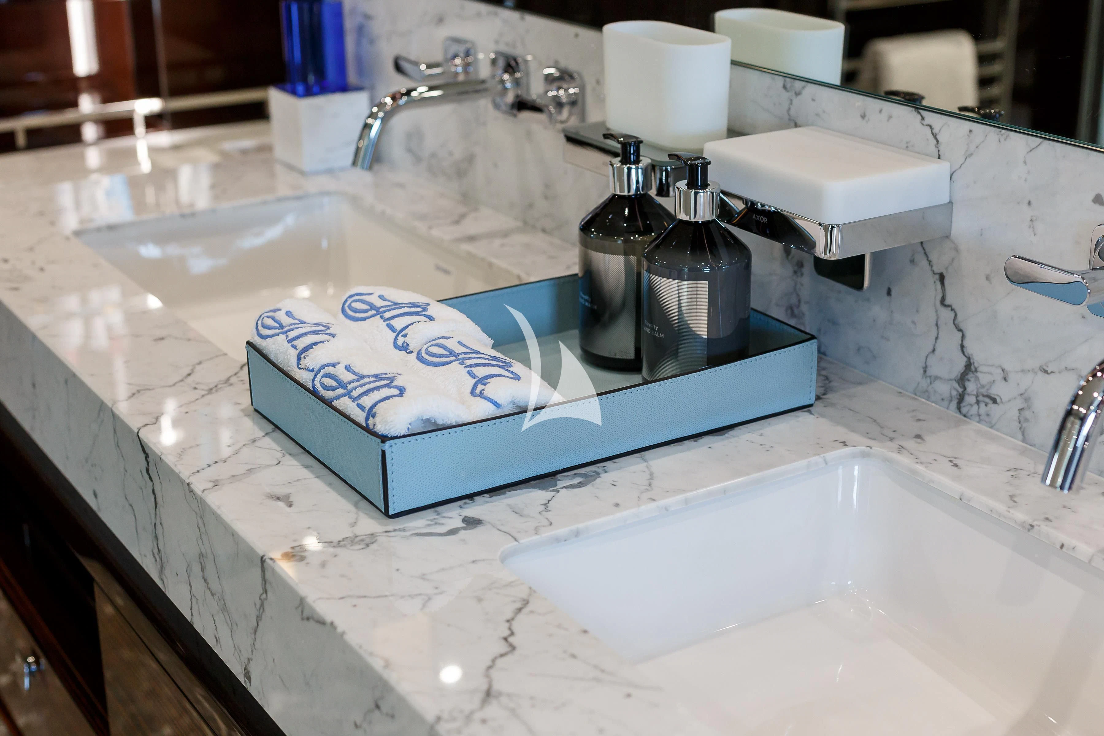 a bathroom with a sink and a large blue and white tile counter aboard NO.9 Yacht for Sale