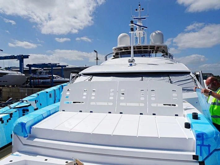 a large white boat in a harbor aboard NO.9 Yacht for Sale