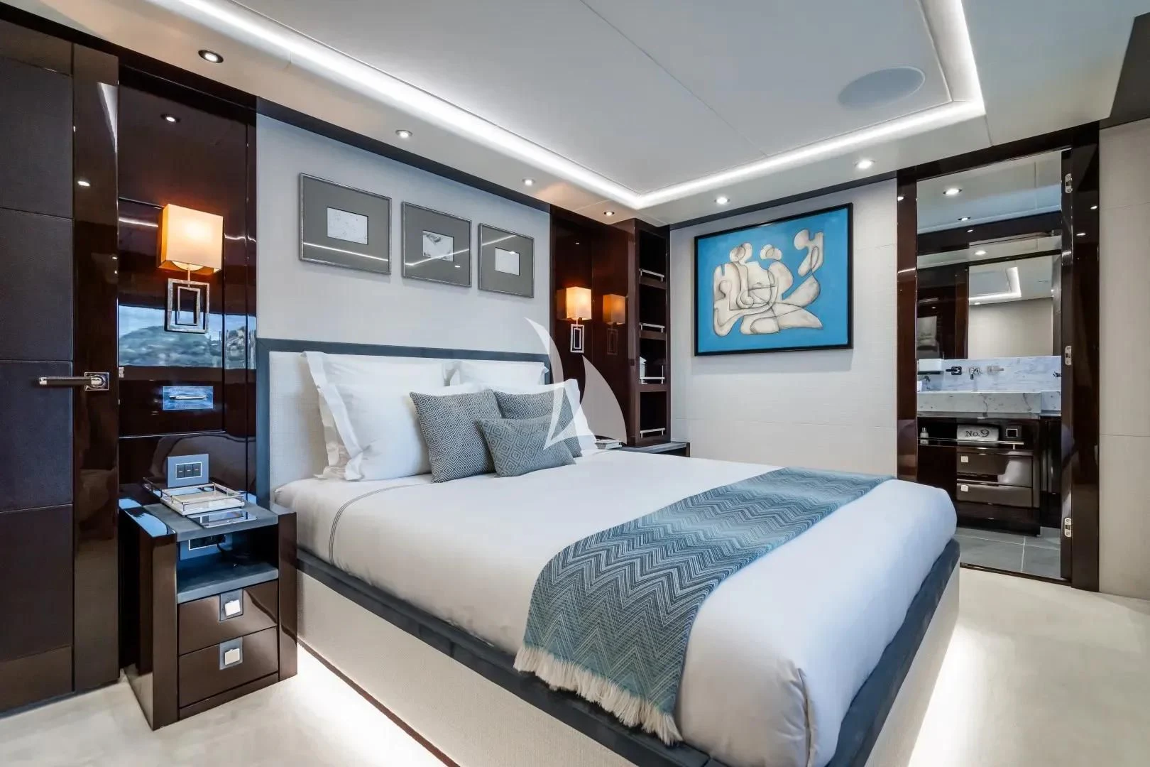 a bedroom with a bed and a desk aboard NO.9 Yacht for Sale