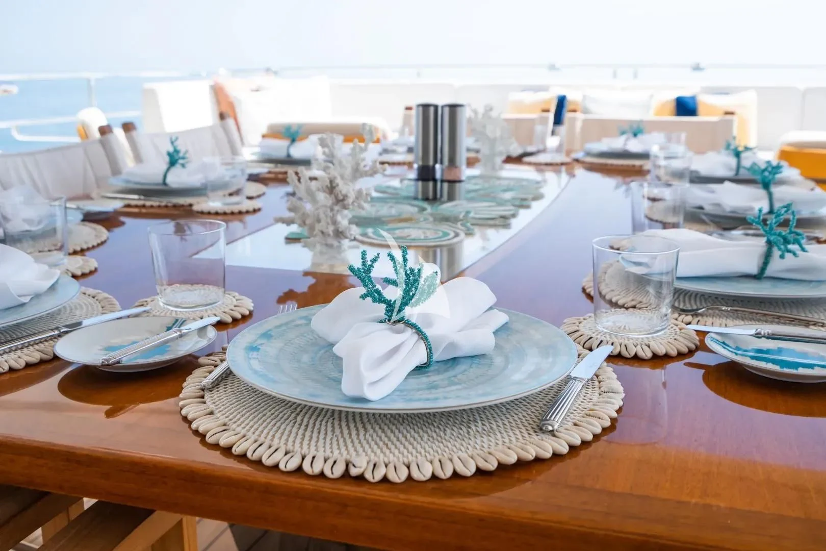 a table with plates and glasses aboard NO.9 Yacht for Sale