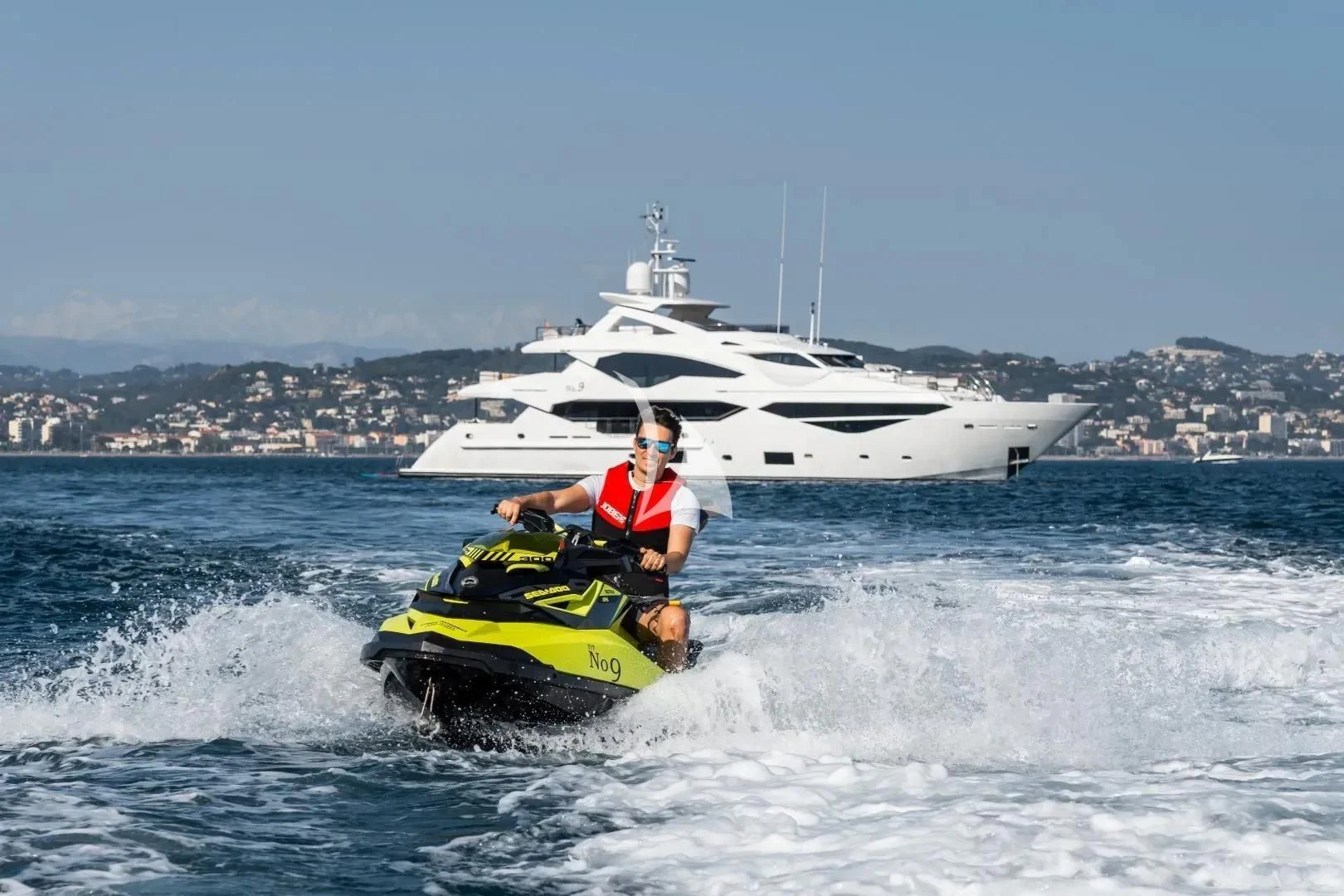 a man on a jet ski aboard NO.9 Yacht for Sale