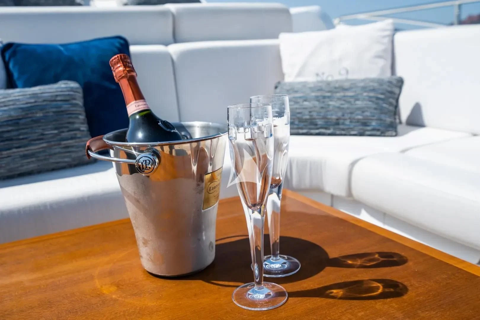a glass of beer and a glass of ice on a table aboard NO.9 Yacht for Sale