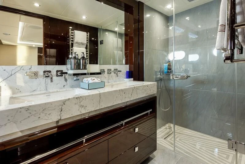 a bathroom with a glass shower aboard NO.9 Yacht for Sale