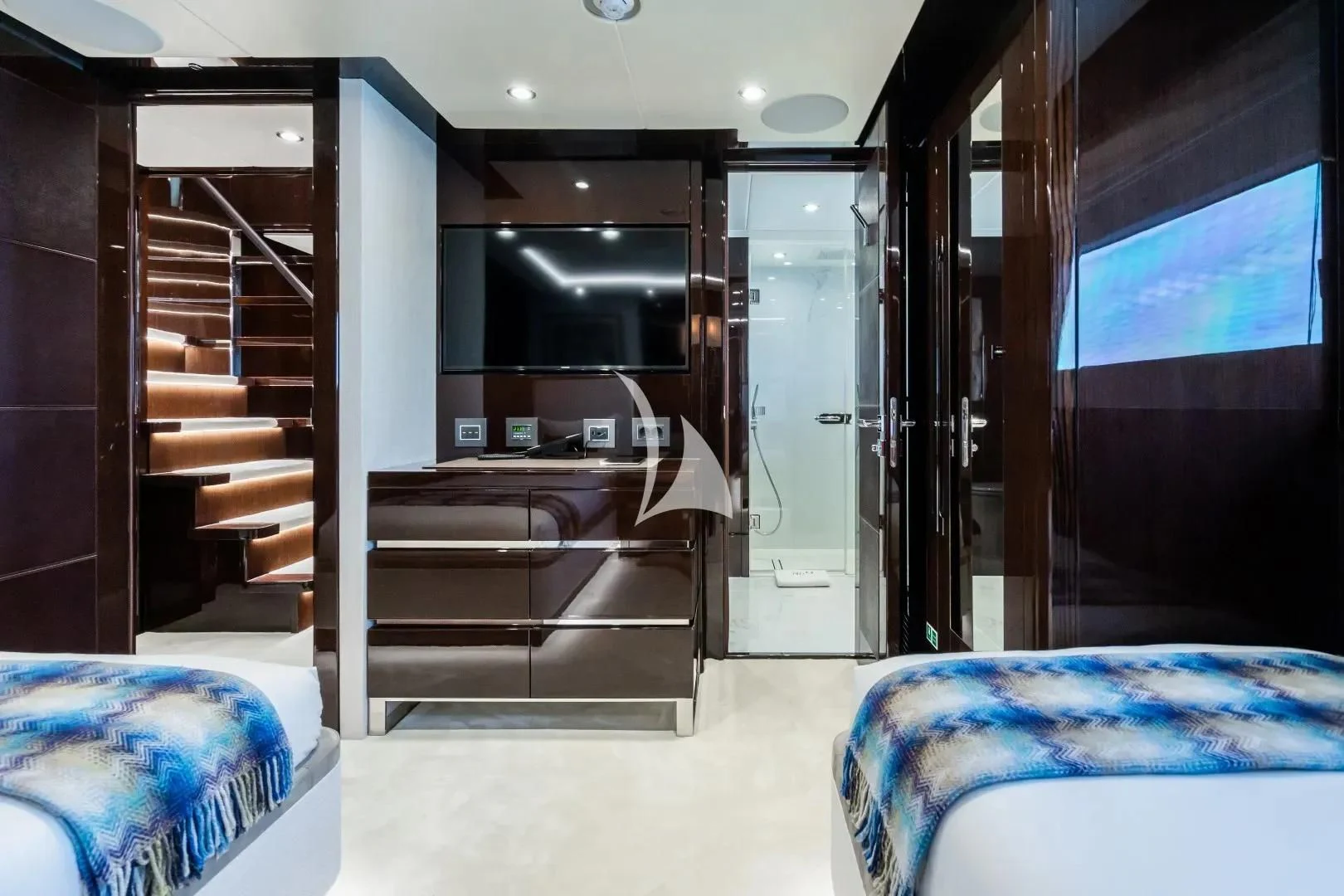 a room with a bed and a staircase aboard NO.9 Yacht for Sale