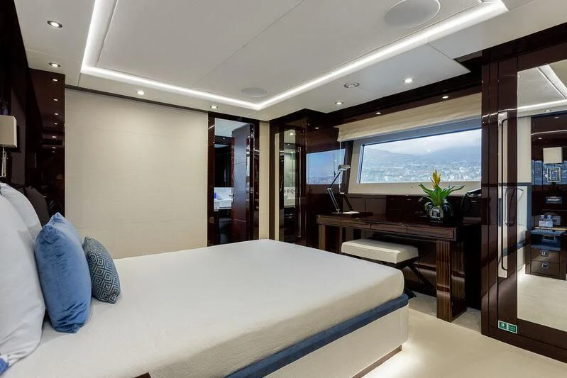 a room with a bed and desk aboard NO.9 Yacht for Sale