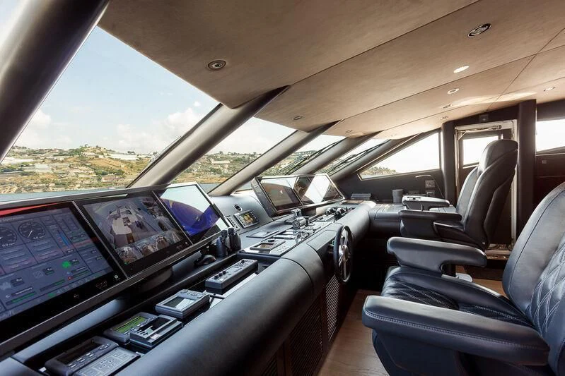 inside of a car with many monitors and laptops on the seats aboard NO.9 Yacht for Sale