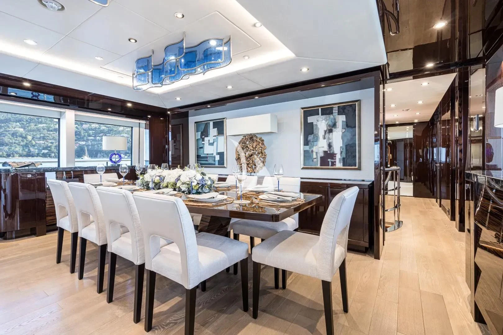 a dining room with a table and chairs aboard NO.9 Yacht for Sale