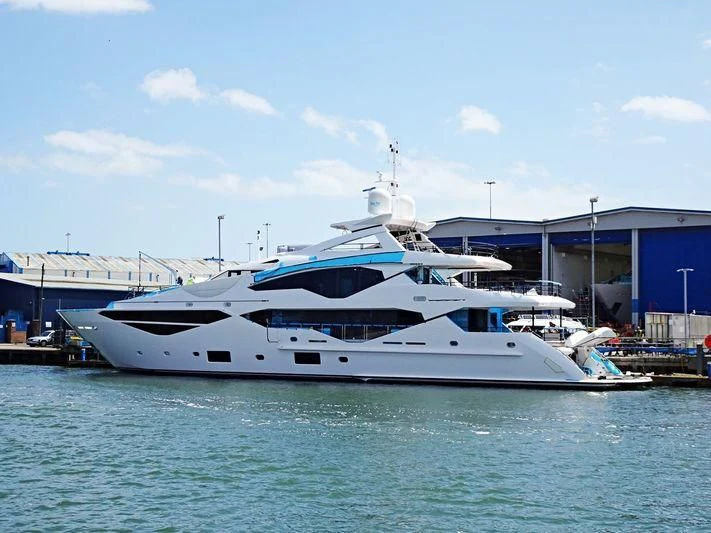 a white yacht docked at a pier aboard NO.9 Yacht for Sale