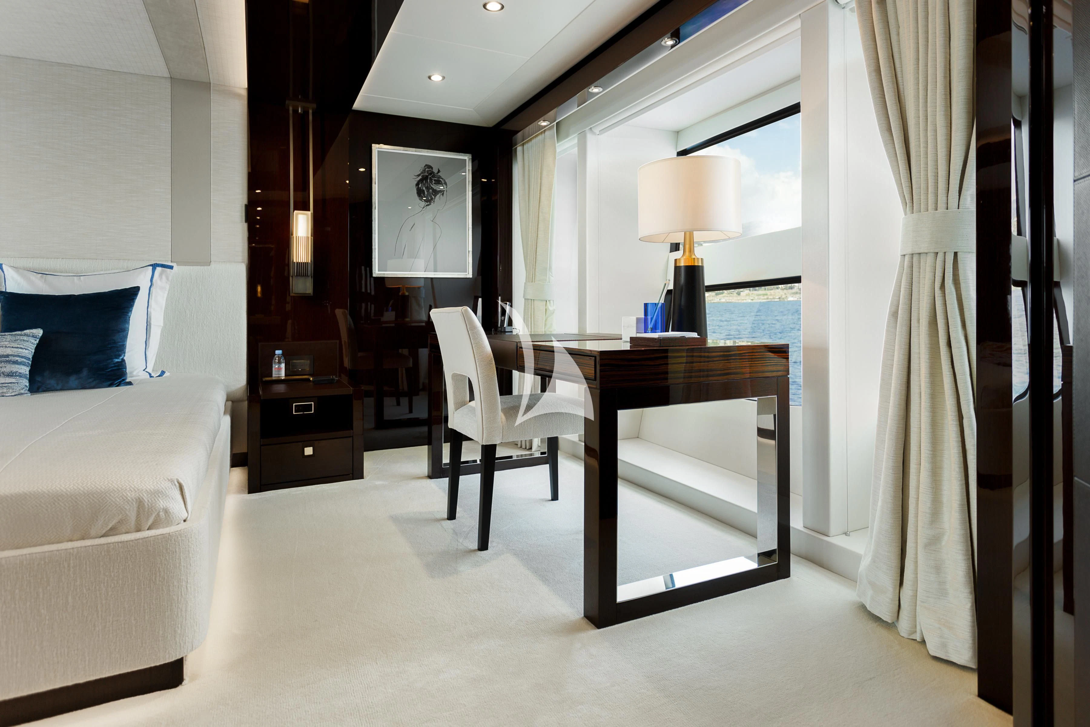 a bedroom with a desk and a bed aboard NO.9 Yacht for Sale