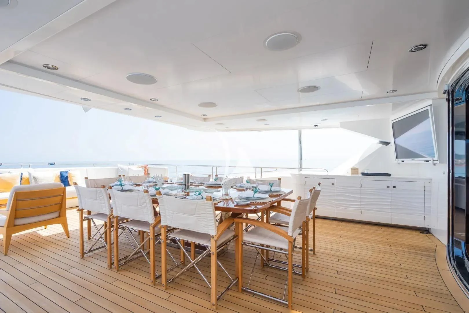 a room with a table and chairs aboard NO.9 Yacht for Sale