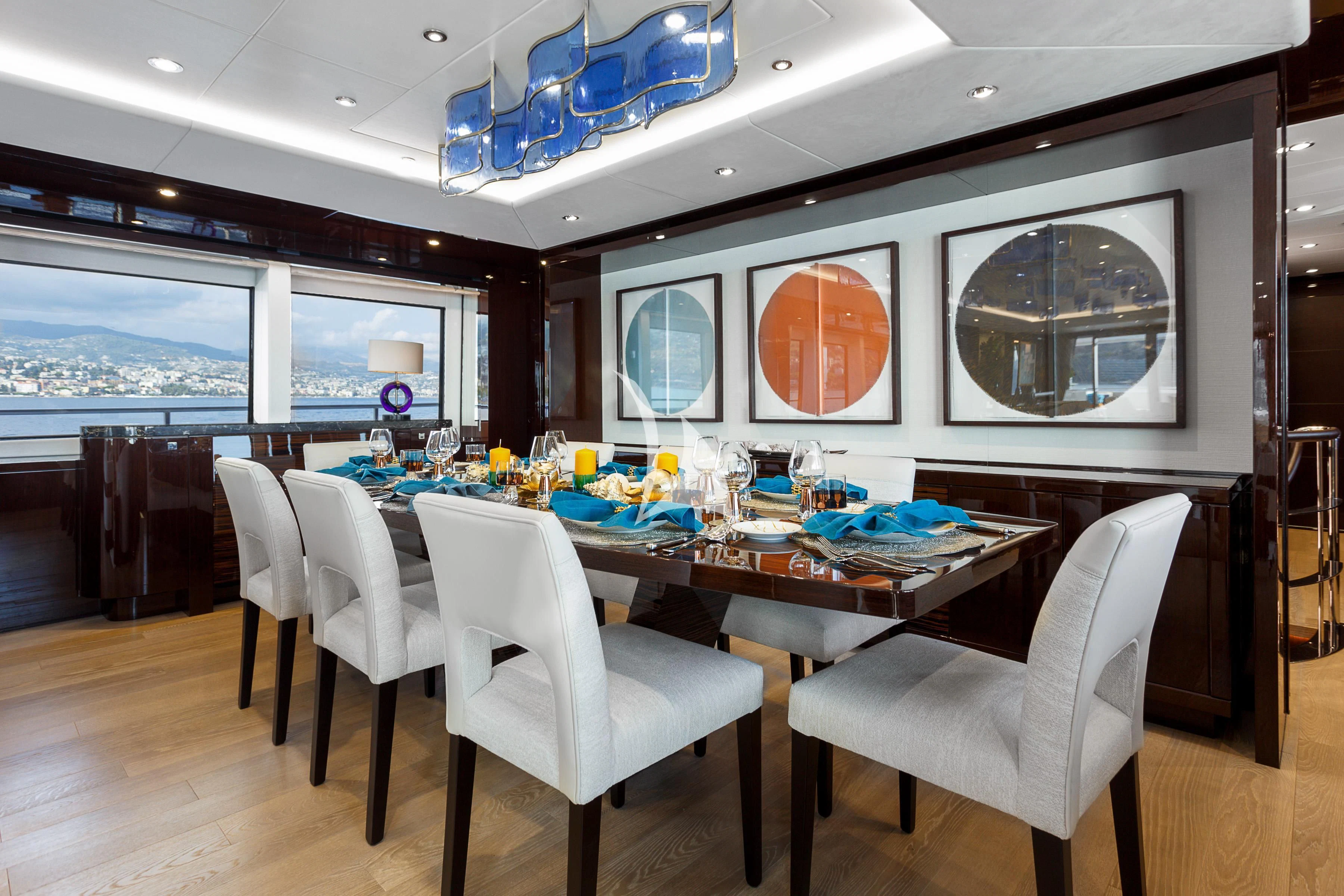 a dining table in a room aboard NO.9 Yacht for Sale