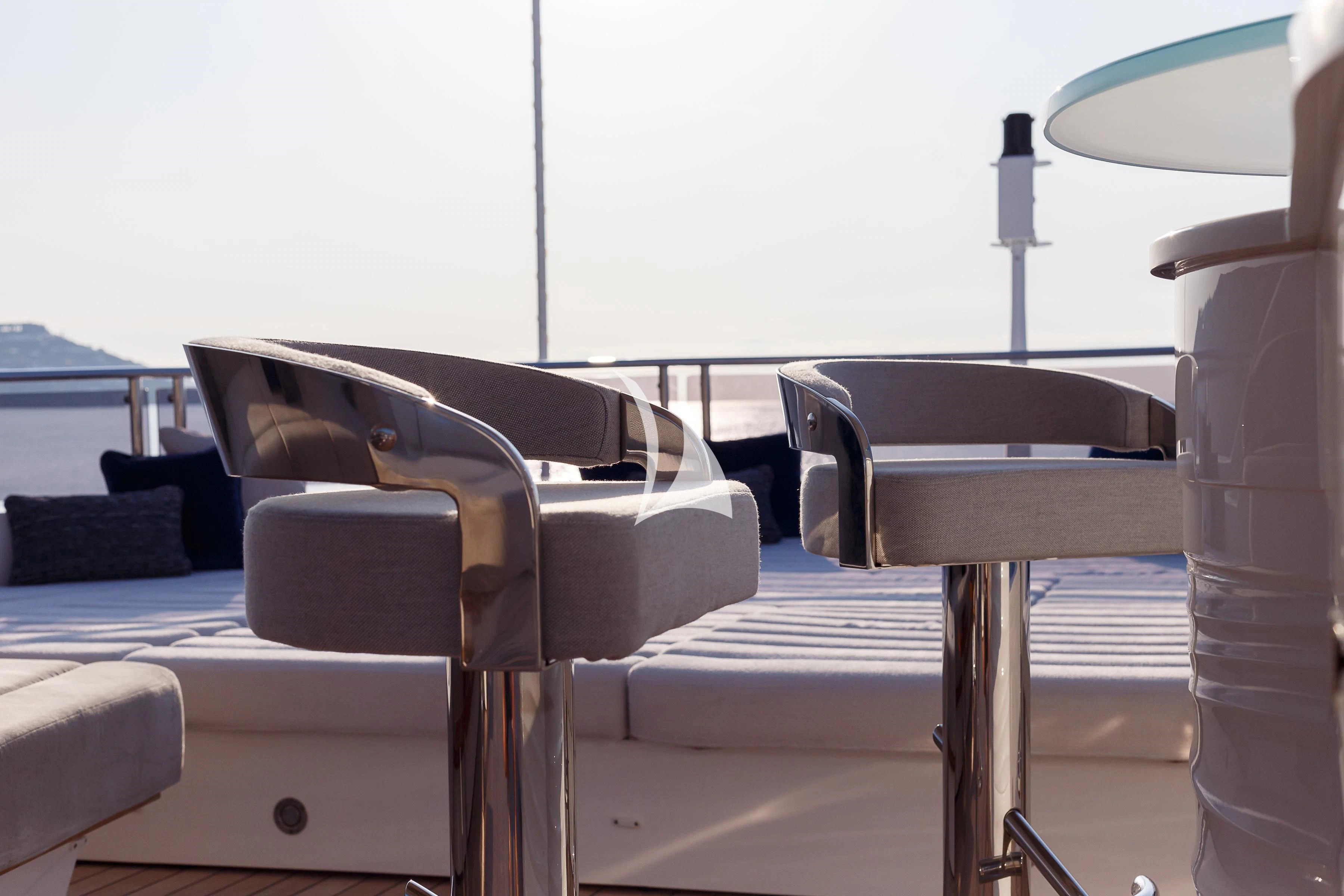 a couple of chairs next to a table and a chair aboard NO.9 Yacht for Sale