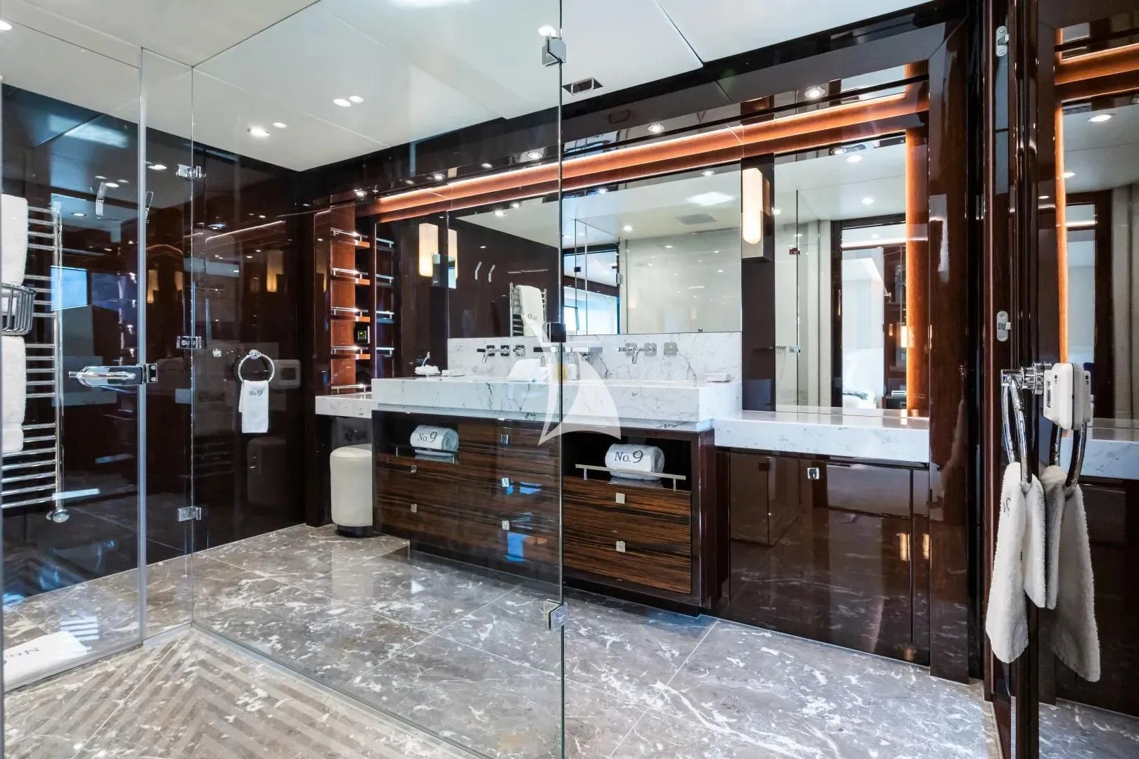 a large bathroom with a large mirror aboard NO.9 Yacht for Sale