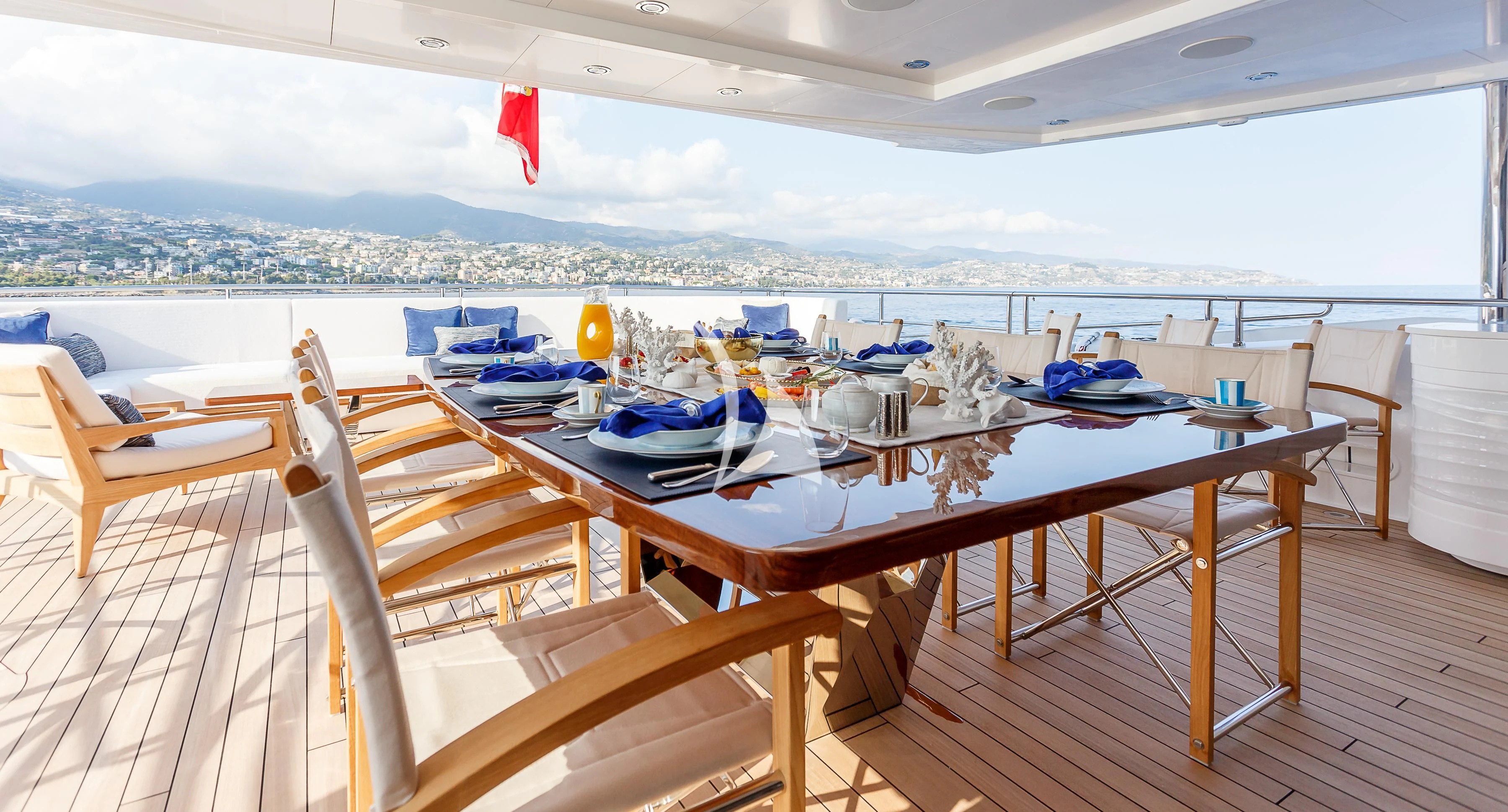 a deck with a table and chairs on it aboard NO.9 Yacht for Sale