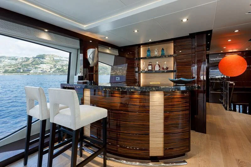 a room with a table and chairs aboard NO.9 Yacht for Sale