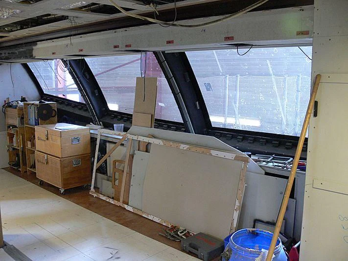 a room with boxes and a ladder aboard NIRVANA FORMENTERA Yacht for Sale