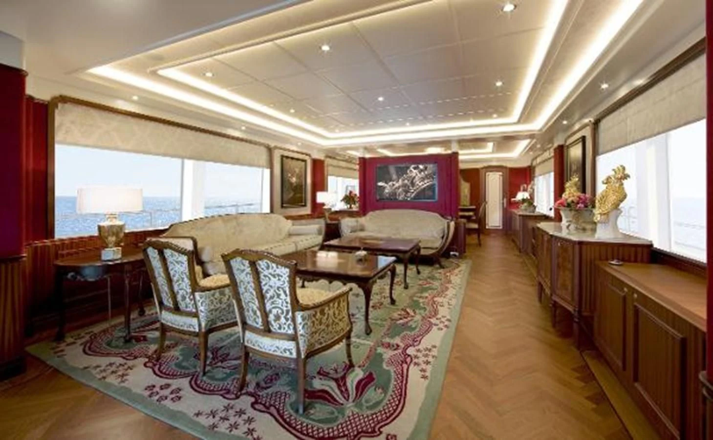 a living room with a rug aboard 121FT EXPLORER 37 Yacht for Sale