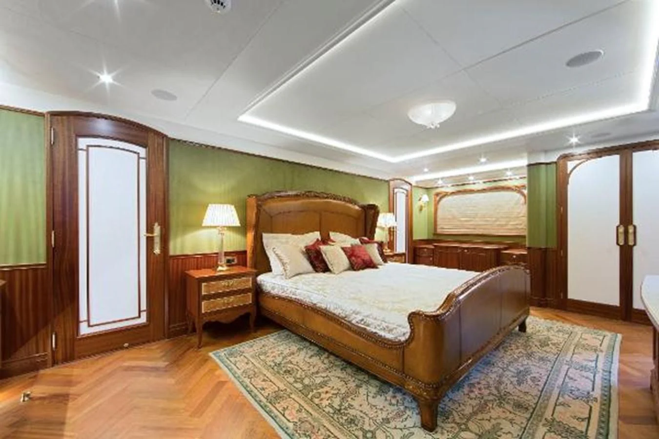 a bedroom with a bed and a desk aboard 121FT EXPLORER 37 Yacht for Sale