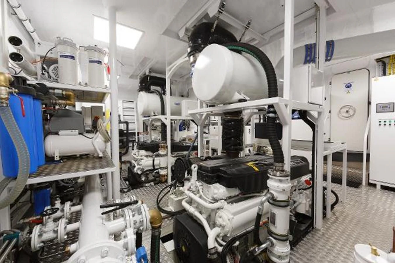 a room with white machines aboard 121FT EXPLORER 37 Yacht for Sale
