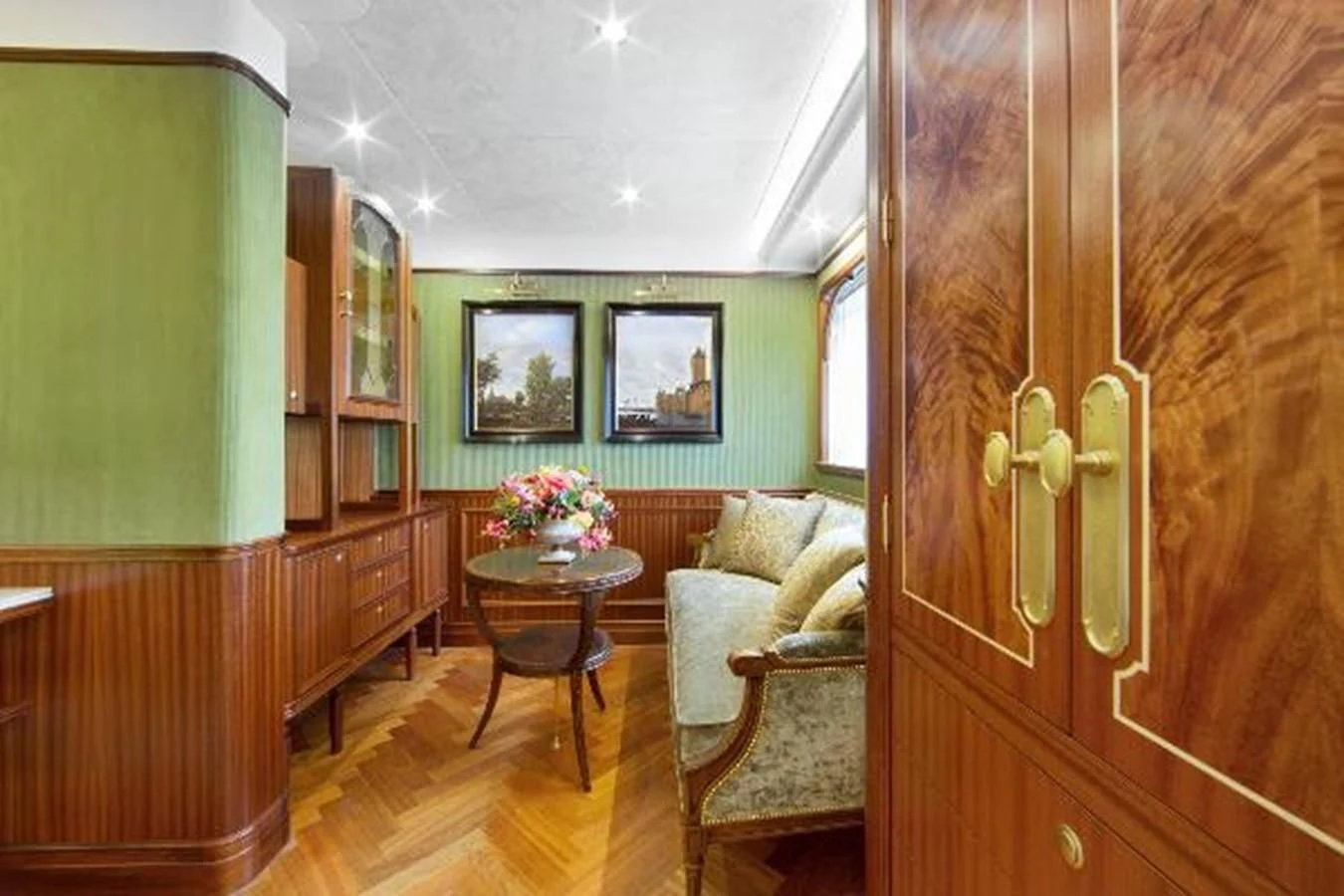 a room with a table and chairs aboard 121FT EXPLORER 37 Yacht for Sale