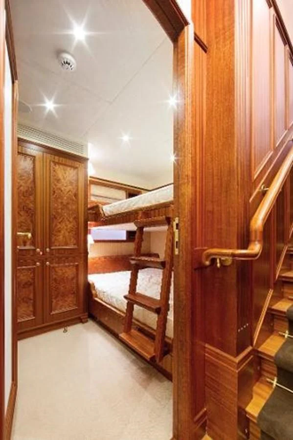 a wooden bunk bed in a room aboard 121FT EXPLORER 37 Yacht for Sale