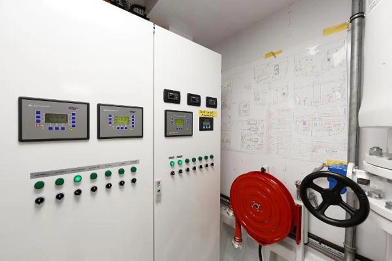 a room with a white wall and a red chair and a black bicycle aboard 121FT EXPLORER 37 Yacht for Sale