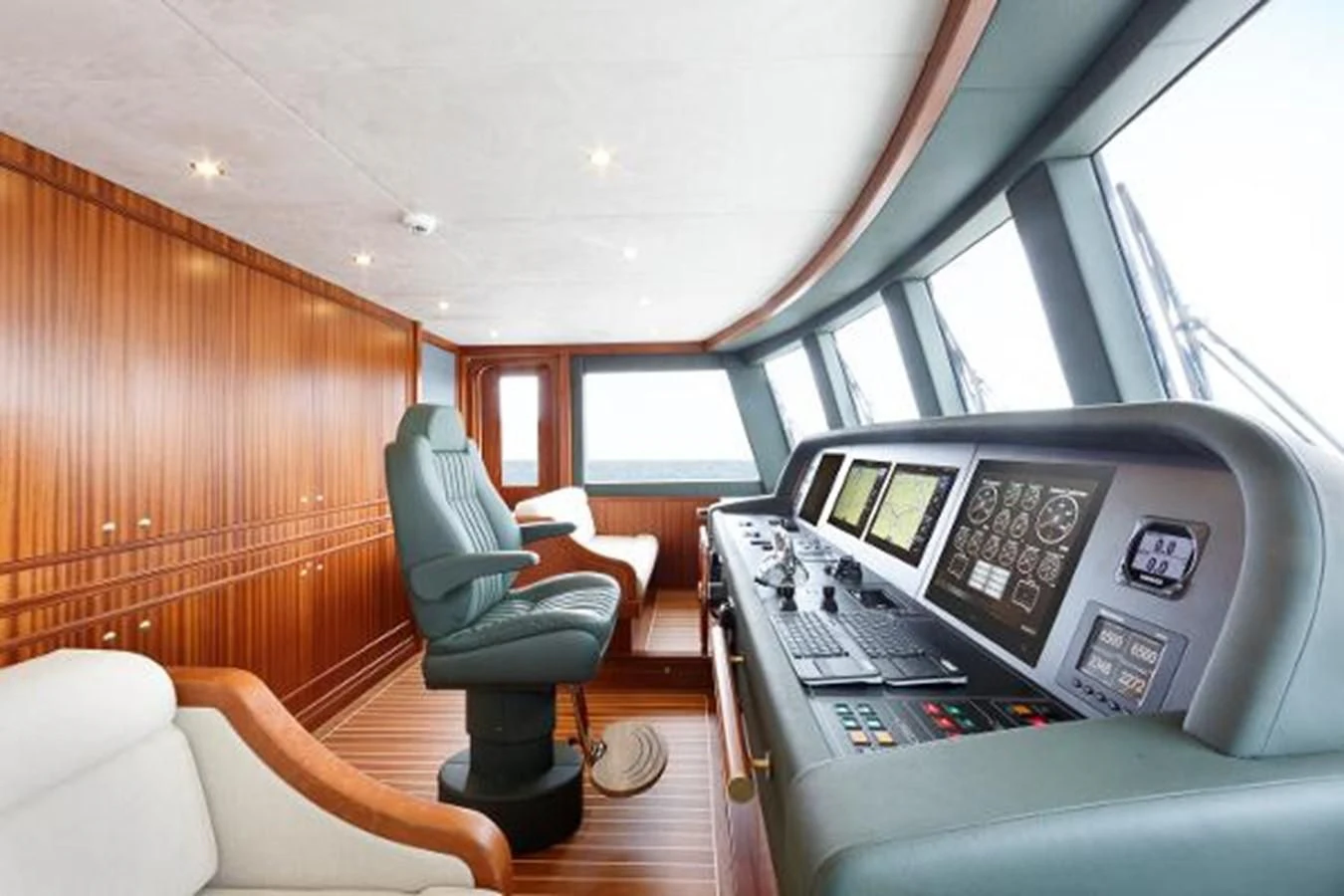 a person sitting in a vehicle aboard 121FT EXPLORER 37 Yacht for Sale