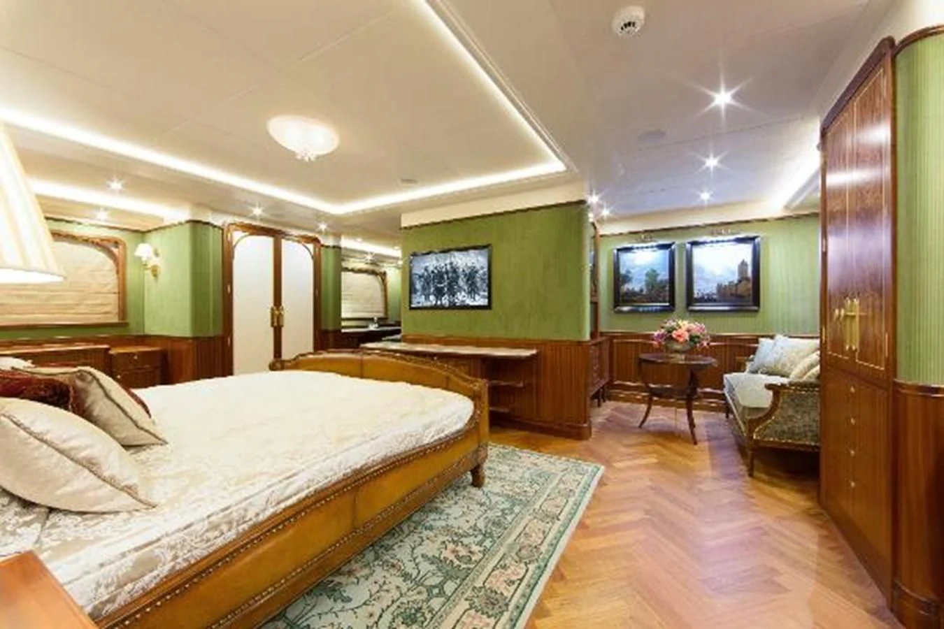 a bedroom with a bed and a couch aboard 121FT EXPLORER 37 Yacht for Sale