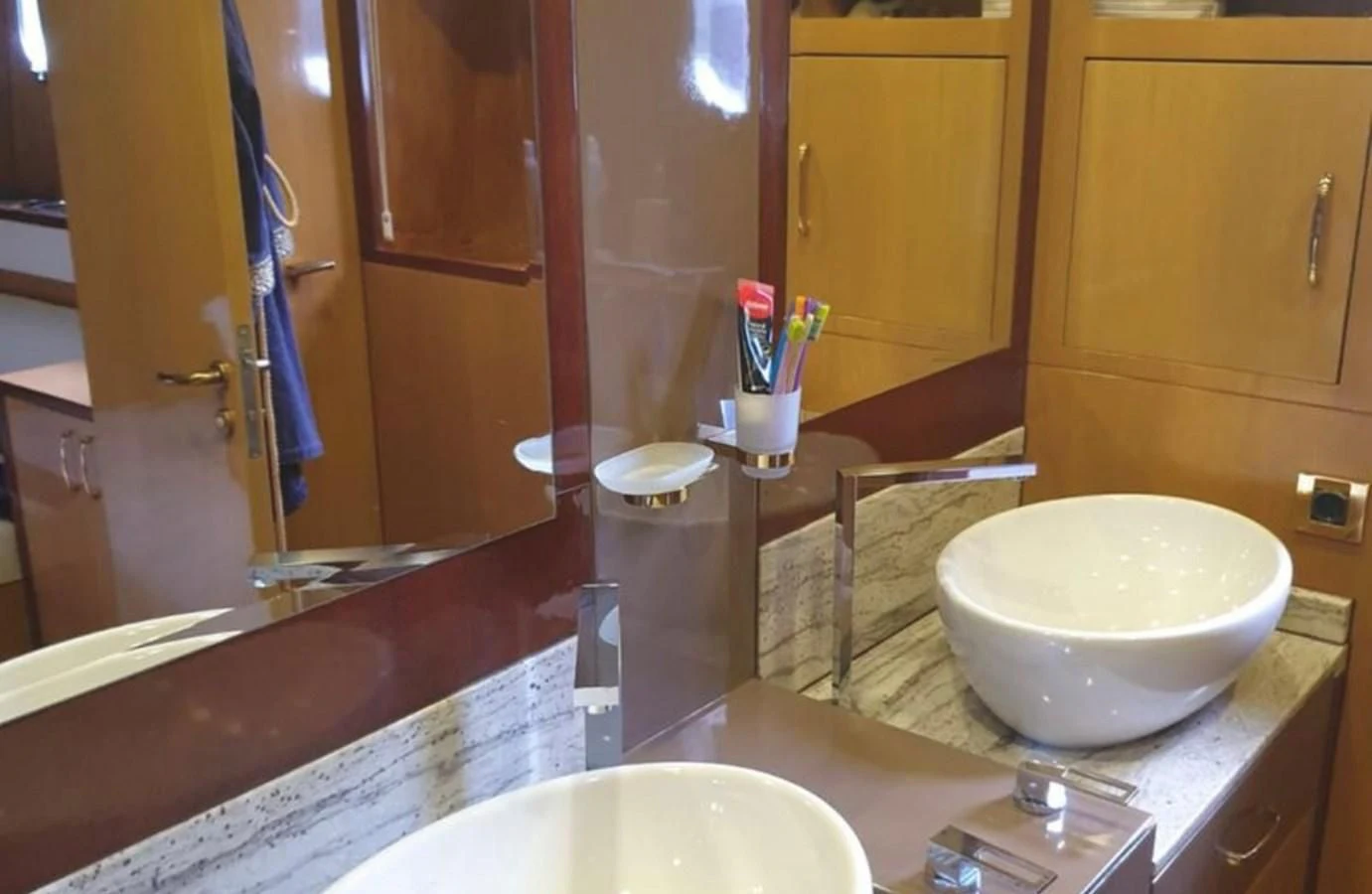 a bathroom with a large mirror aboard NIKE III Yacht for Sale