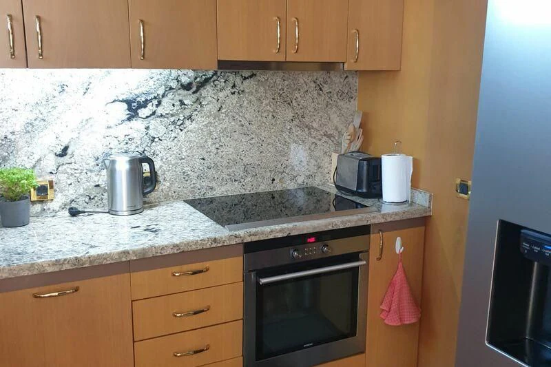 a kitchen with a granite counter top aboard NIKE III Yacht for Sale