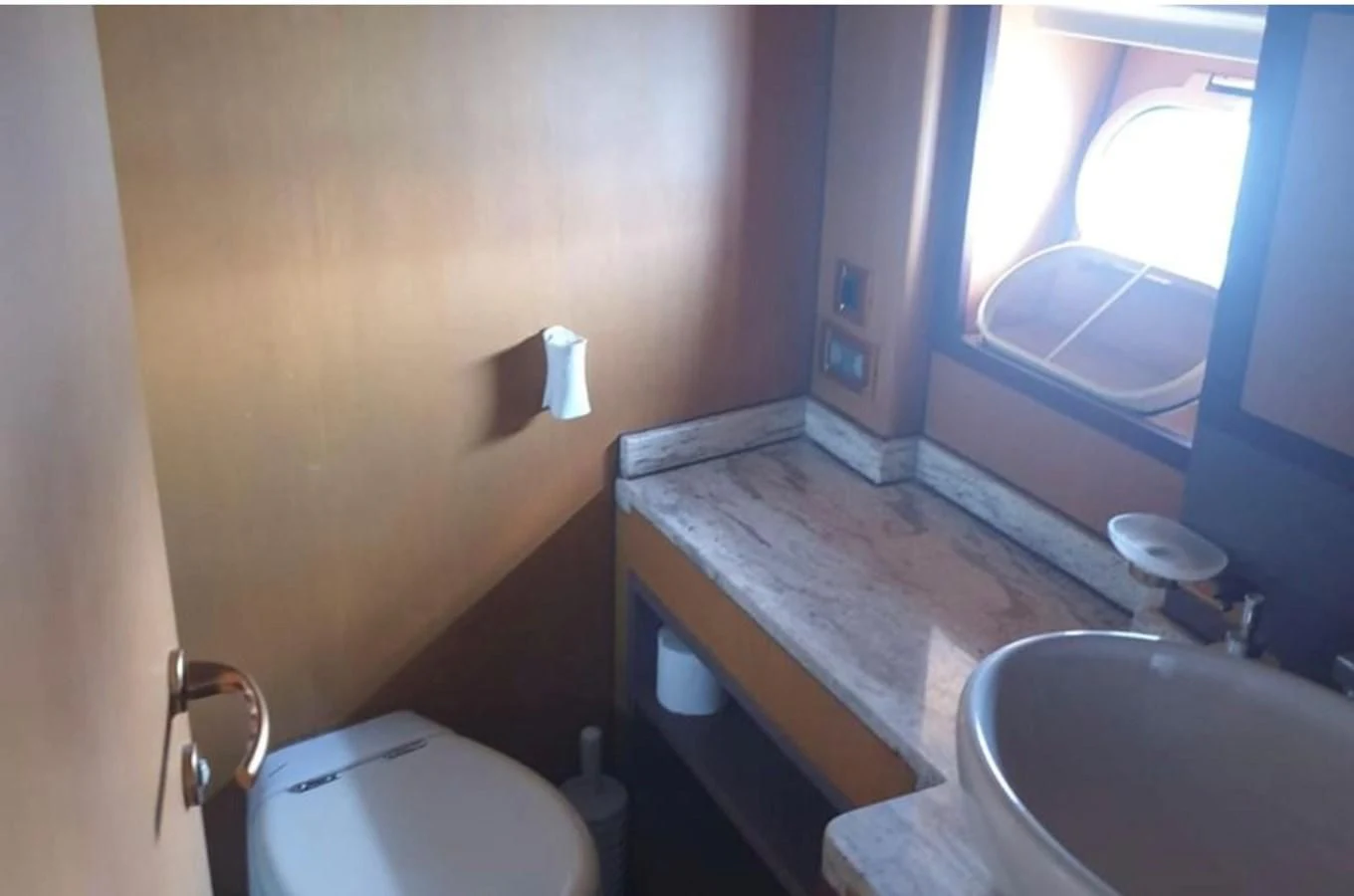 a bathroom with a sink and toilet aboard NIKE III Yacht for Sale