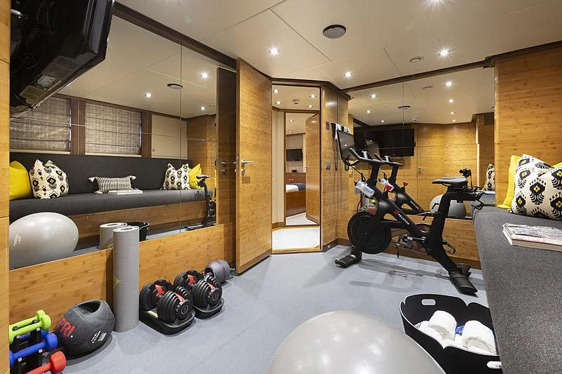 a room with a large mirror and a bench aboard LUMIR Yacht for Sale