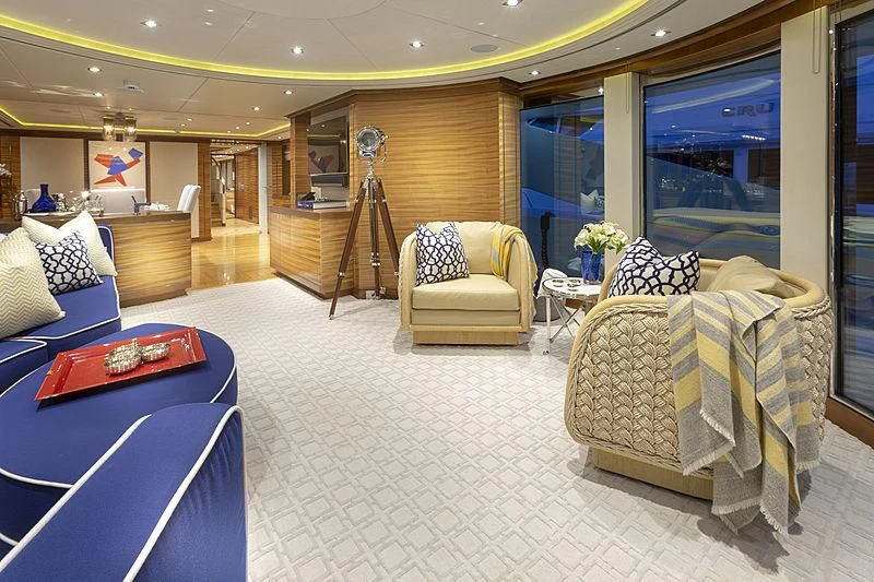 a living room with a large mirror aboard LUMIR Yacht for Sale