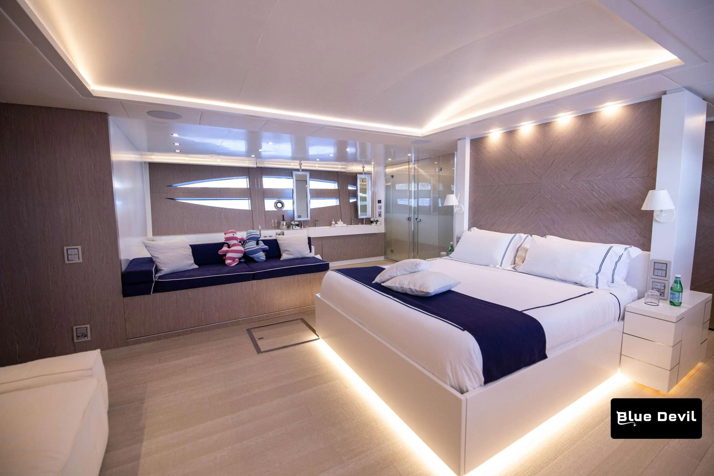 a room with a bed and a desk aboard BLUE DEVIL Yacht for Sale