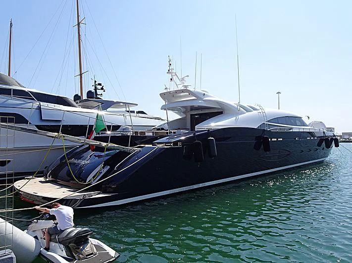 a boat docked at a pier aboard BLUE DEVIL Yacht for Sale