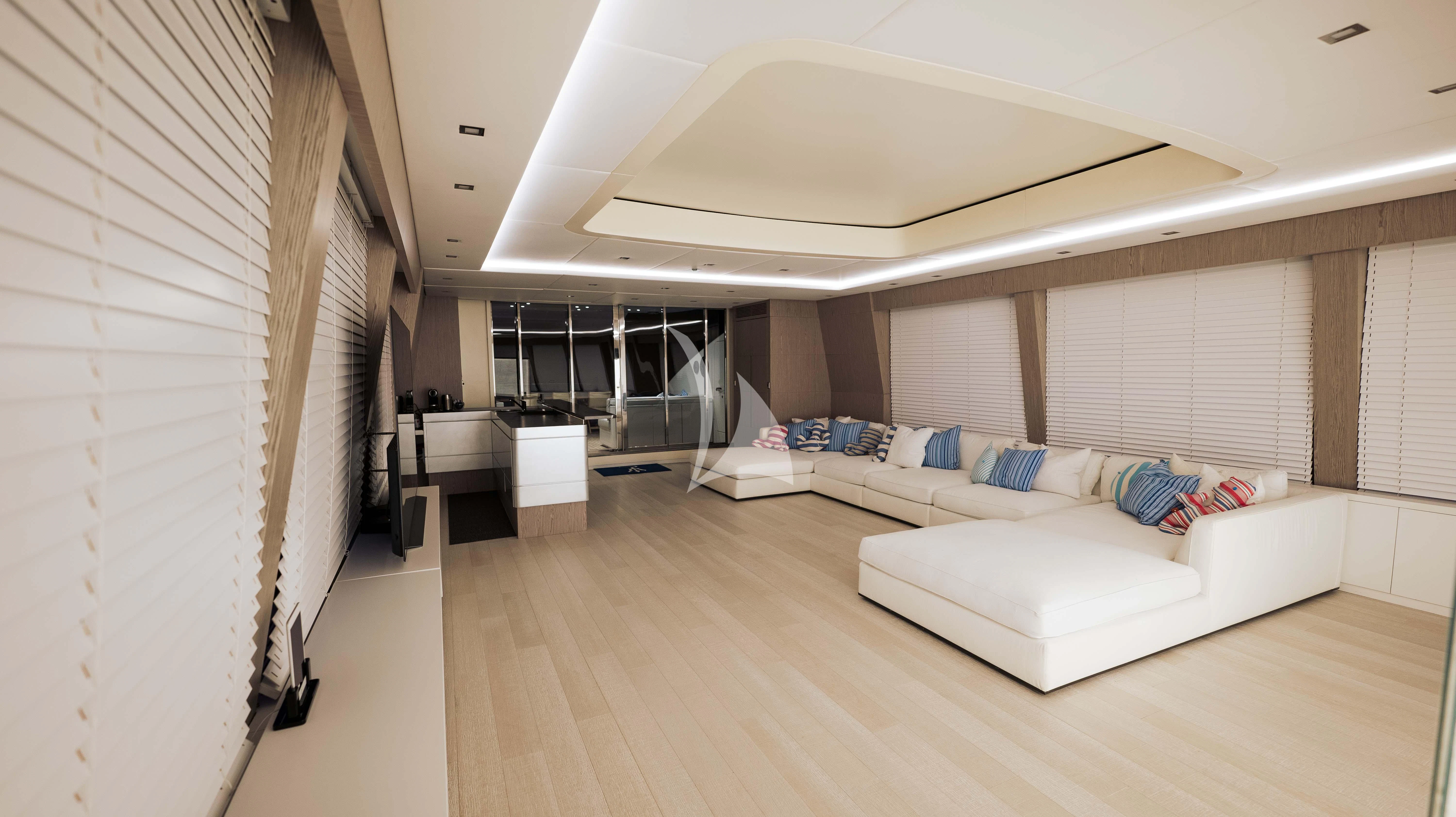 a room with a bed and a table aboard BLUE DEVIL Yacht for Sale