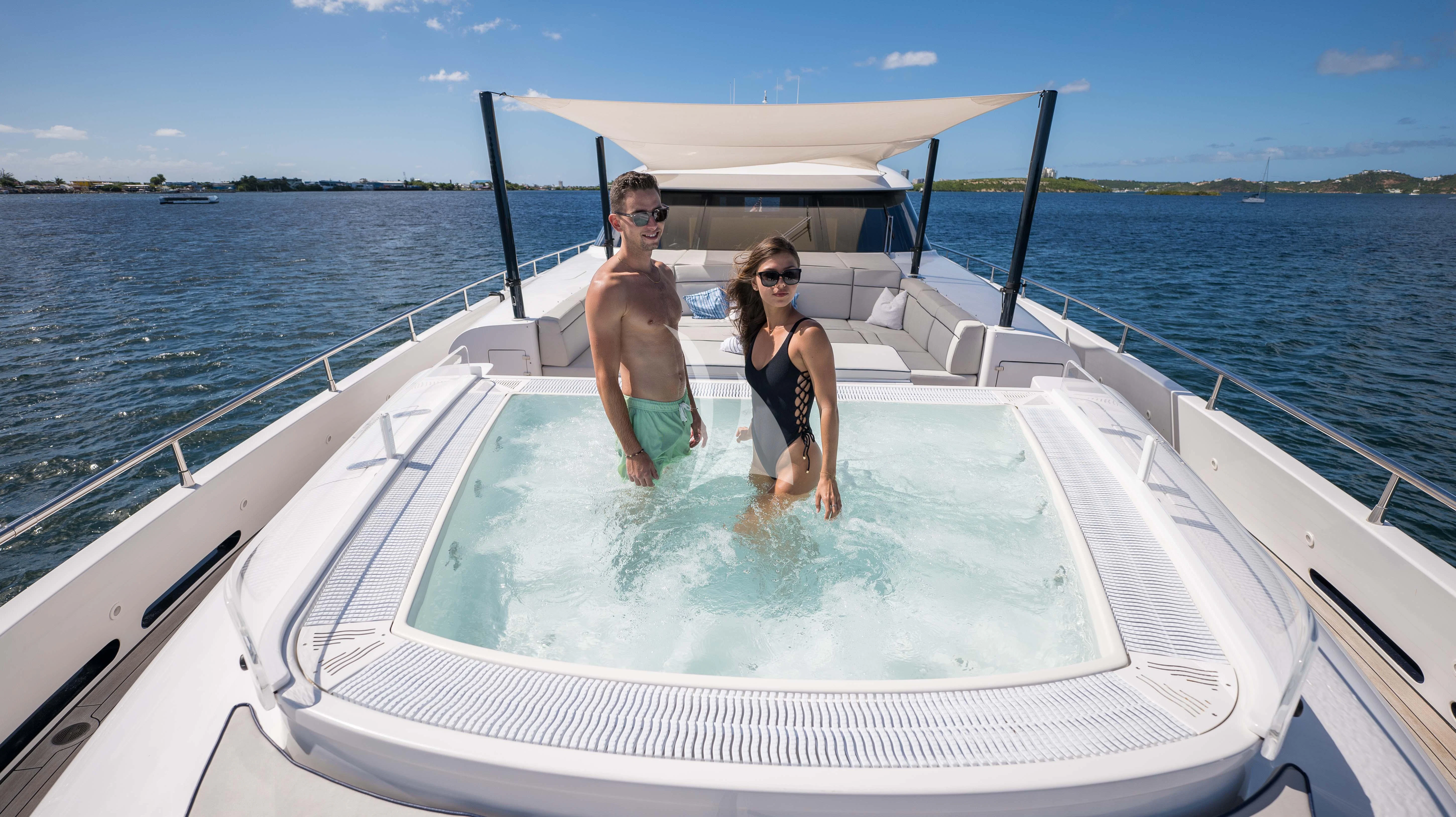 a man and woman on a boat aboard BLUE DEVIL Yacht for Sale
