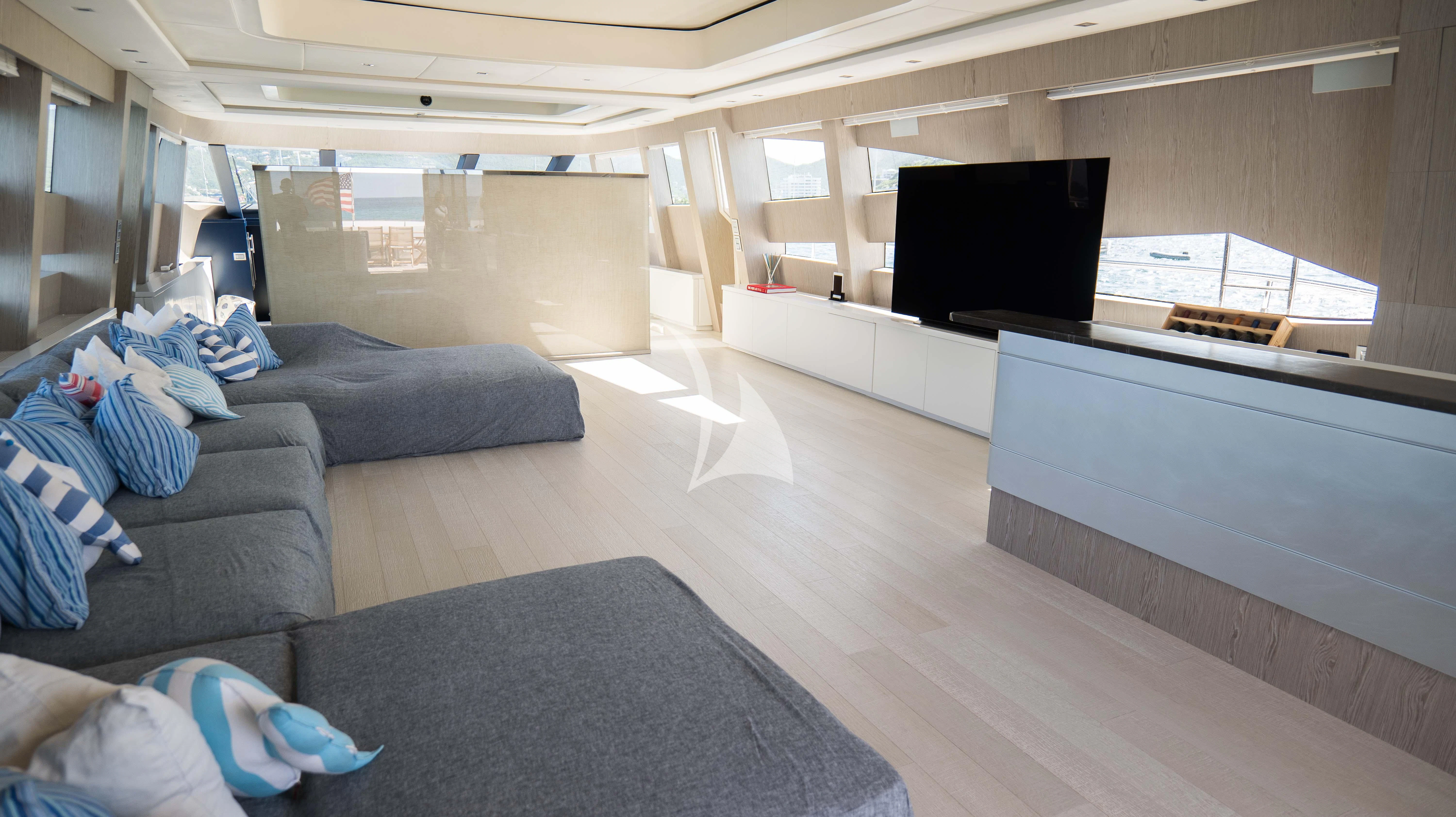 a living room with a couch and a tv aboard BLUE DEVIL Yacht for Sale