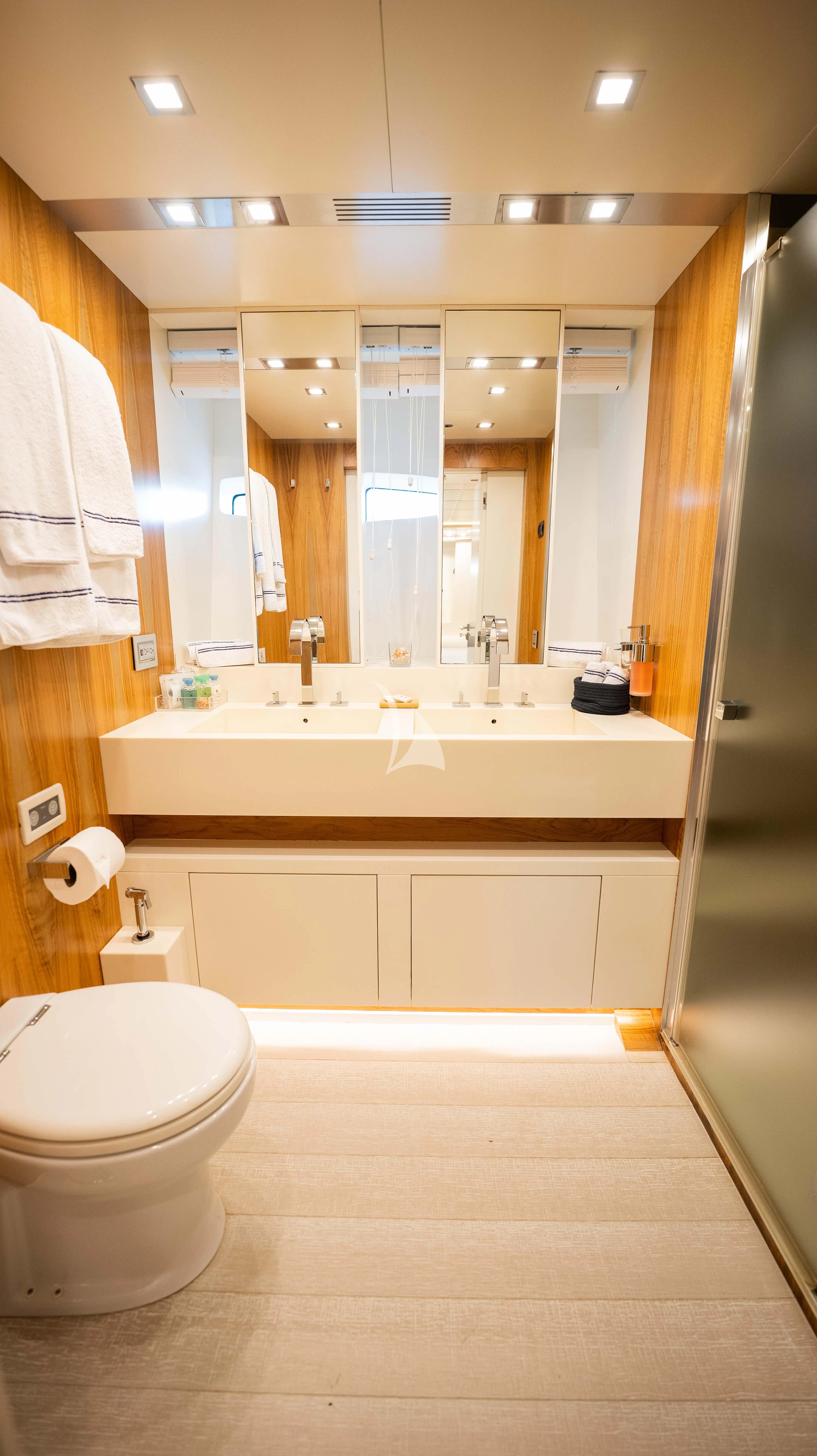a bathroom with a large mirror aboard BLUE DEVIL Yacht for Sale