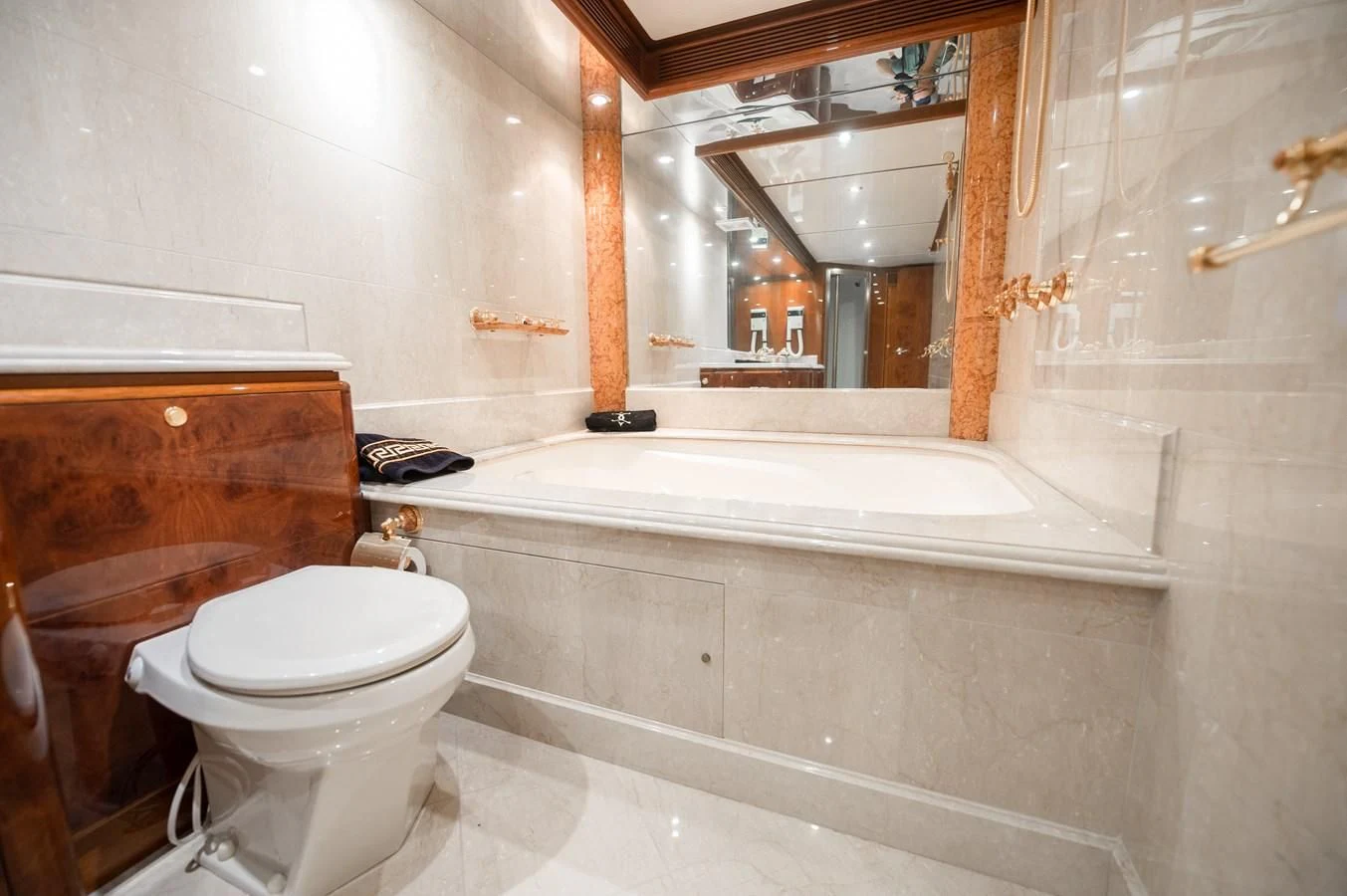 a bathroom with a toilet and a bathtub aboard DOLCE VITA Yacht for Sale