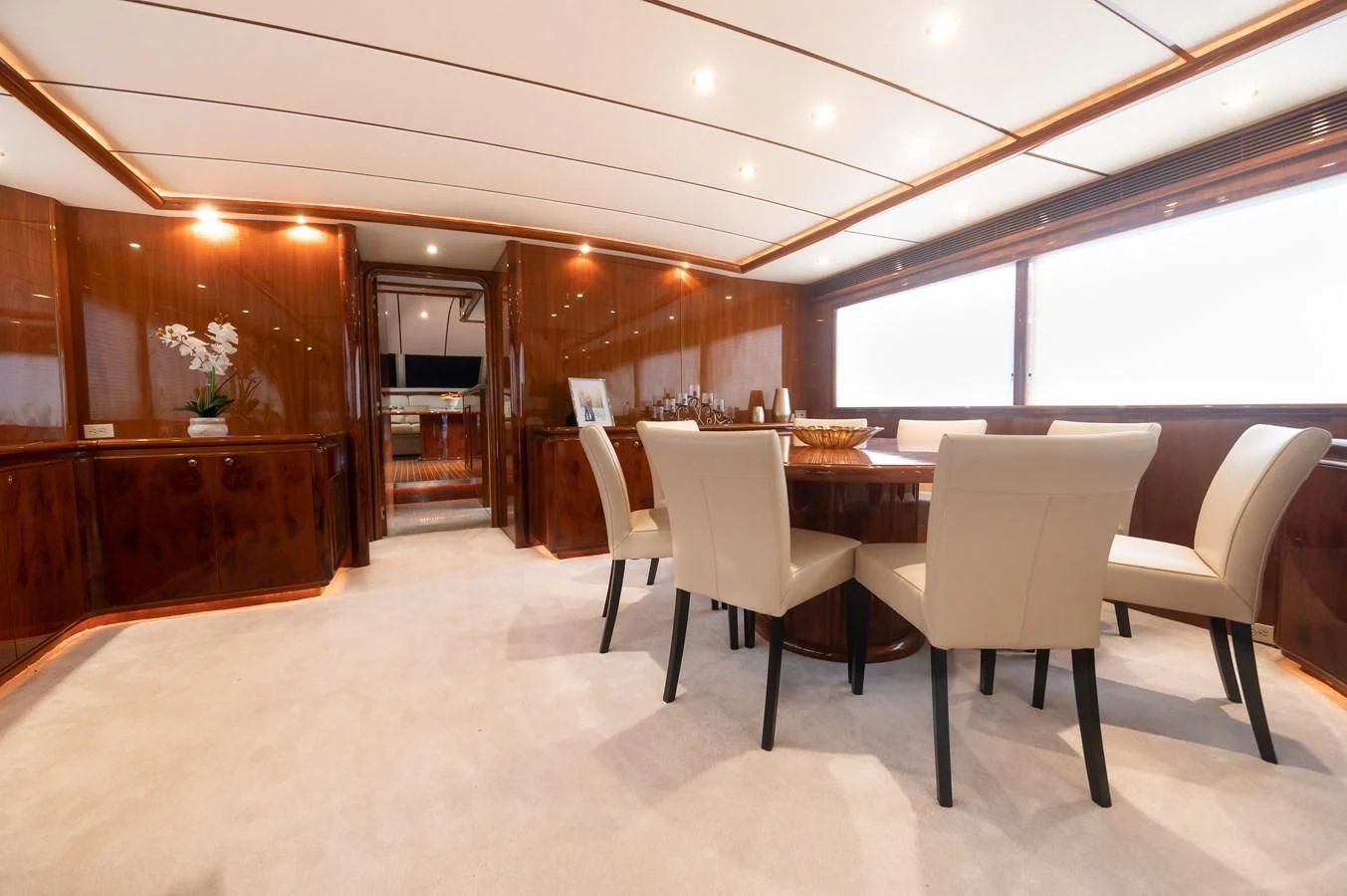a room with a table and chairs aboard DOLCE VITA Yacht for Sale